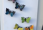 Bronzen vogels en vlinders in kleur